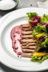 Christmas roast duck served with berry sauce and and salad, Food recipe background. Close up