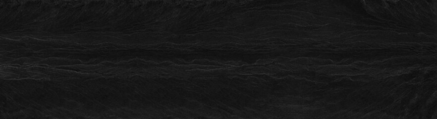 Panorama dark gray stone background with copy space. Black grunge banner with rock texture.