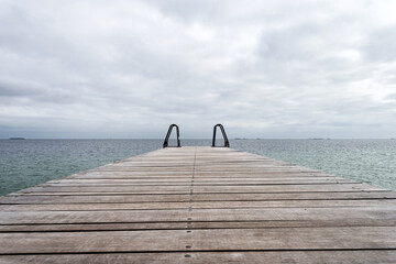 Wooden pier leading to the sea. Baltic Sea, Copenhagen. Denmark. Freedom. Trips
