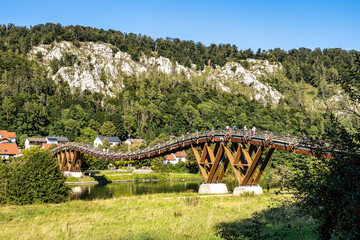 Wooden bridge Tatzelwurm in Essing at Altmuehl river below the ruins of Randeck Castle, Bavaria,...