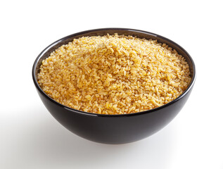 Dried bulghur in blak bowl isolated on white background with clipping path