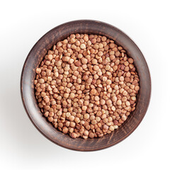 Uncooked lentils in ceramic bowl isolated on white background with clipping path