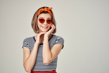 cheerful woman in sunglasses with a bandage on her head fashion posing