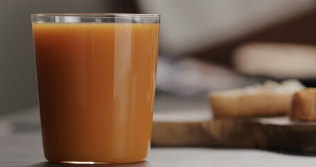 pumpkin juice into tumbler glass with copy space