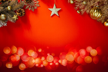 Golden Christmas decorations on a bright red background