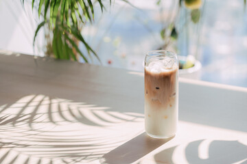 Cafe latte on the table where the sun shines.