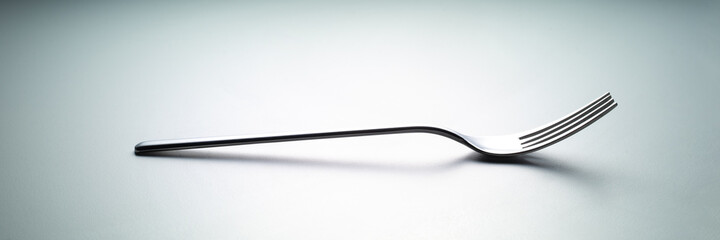single fork side by side on white background. concept banner