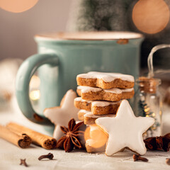 Stack of cinnamon stars cookies, traditional german zimtsterne. Close up of gingerbread cookies....