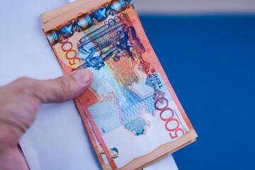 A bribe in the form of money with a face value of 5,000 tenge. Or a salary. Volute: Kazakhstani...