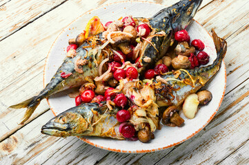 Baked mackerel stuffed with cherries © nikolaydonetsk