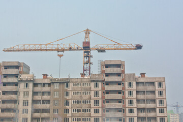 empty apartment house high rise building construction background - crisis in real estate  property...
