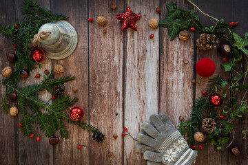 christmas frame with bell and a red star on a rustic, old, wooden background, vintage style