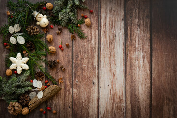 christmas arrangement with snowman nuts and decoration on a rustic, old, wooden background, vintage style