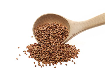  Buckwheat seed pile with wooden spoon isolated on white  