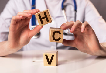 HCV acronym for medical test. Word on cubes.