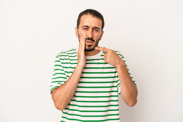 Young caucasian man isolated on white background having a strong teeth pain, molar ache.