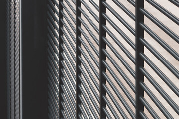 Prison bars close up. Separation of prisoners in cells with iron grilles. Soft focus