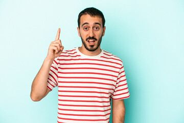 Fototapeta premium Young caucasian man isolated on blue background having some great idea, concept of creativity.