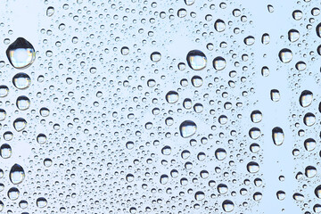 drops glass blue background abstract, transparent cold background water splashes