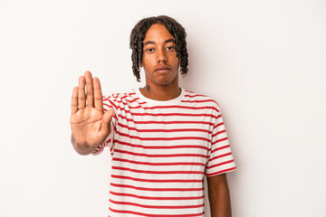 Fototapeta premium Young african american man isolated on white background standing with outstretched hand showing stop sign, preventing you.