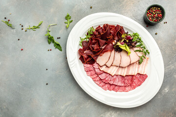 Slices of different tasty smoked sausages. Meat platter with selection. banner, menu, recipe place for text, top view