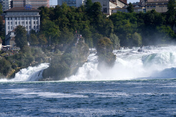 Famous Rhine Falls with rocks and trees on a beautiful autumn day. Photo taken September 25th, 2021, Z&uuml;rich, Switzerland.