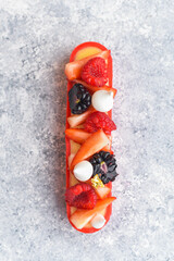Eclair with fresh berries and meringue