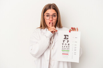 Young optometrist Russian woman isolated on white background keeping a secret or asking for silence.