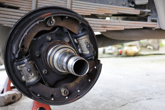 Inside of truck drum brake system tear down inspection and un assembly service by a technician after a long time using.