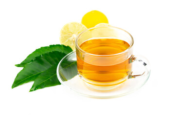 Neem tea in transparent glass with neem leaf and lemon isolated on white background.
