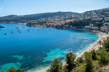 Fototapeta premium Aerial view of the beautiful beaches and the fantastic sea of Villefranche-sur-Mer