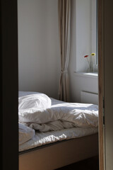 Empty unmade bed in the morning