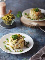 Olivier salad, traditional Russian dish, served on the plate