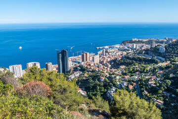 Fototapeta na wymiar Aerial view of Monaco with skyscrapers and blue sea