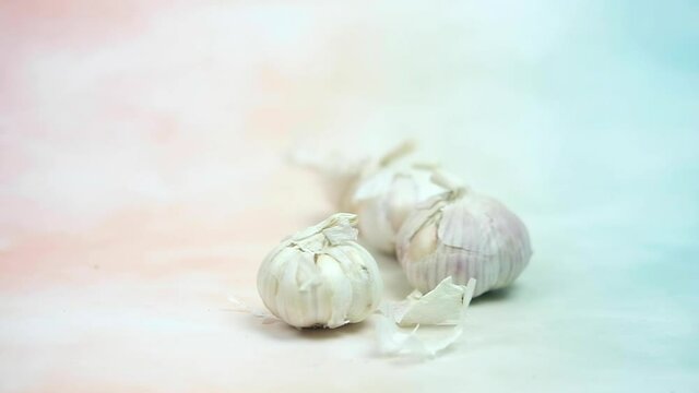 Slow motion and panning of fresh garlic. Close-up