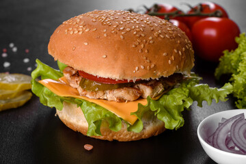 Delicious fresh burger grill with a bun, cheese and meat
