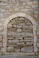 passage in the old wall walled with stones