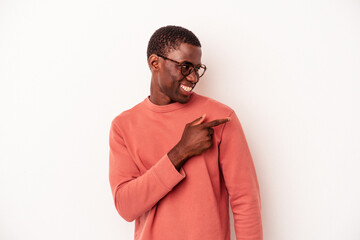 Young African American man isolated on white background looks aside smiling, cheerful and pleasant.