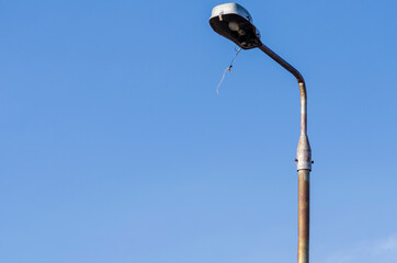 light post on plain blue background