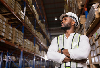 Portrait black male staff working checking stock in logistic warehouse