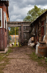 the courtyard of the village house along which the chickens run