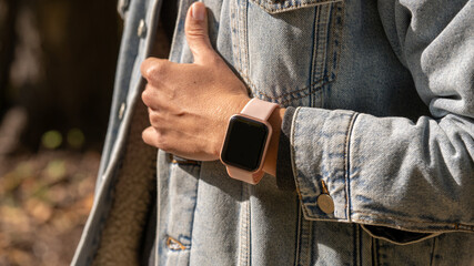 Woman hands in smart watch walking outdoors, step counting, fitness tracker, close up, copy space