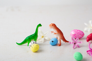 Toys of dinosaurs and Easter eggs holiday concept