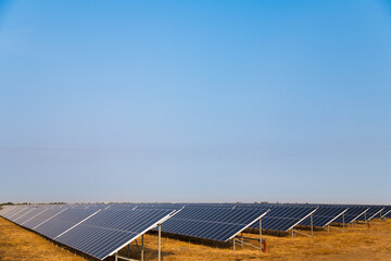 Blue solar panels with the sunny sky