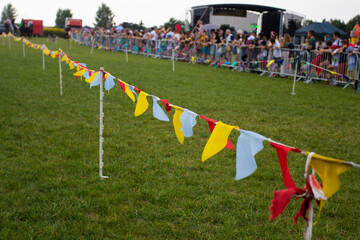 Garland and fencing of crowds of people from the place of the races. Public outdoor event