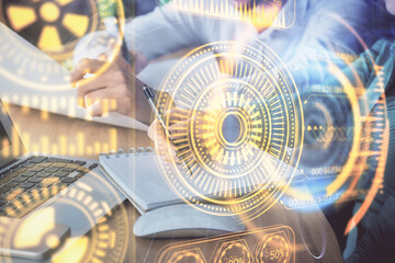 Double exposure of technology theme drawing over people taking notes background. Concept of Tech