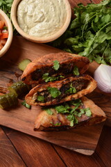 Arayes - kebab in a baked pita. Traditional arab food  - obrazy, fototapety, plakaty