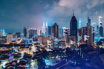 Naklejka premium Stock market graph hologram, night panorama city view of Kuala Lumpur. KL is popular location to gain financial education in Malaysia, Asia. The concept of international research. Double exposure.