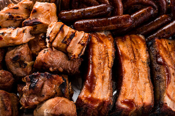 set of grilled ribs and BBQ meat in a delivery box