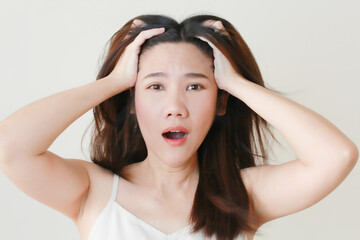 Fototapeta premium Asian women shocked afraid and surprise face touch her head